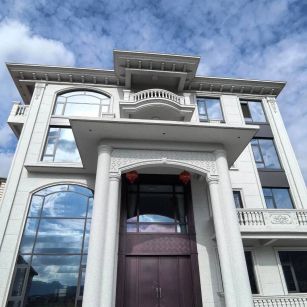 湖南白麻别墅外墙干挂石材效果示例