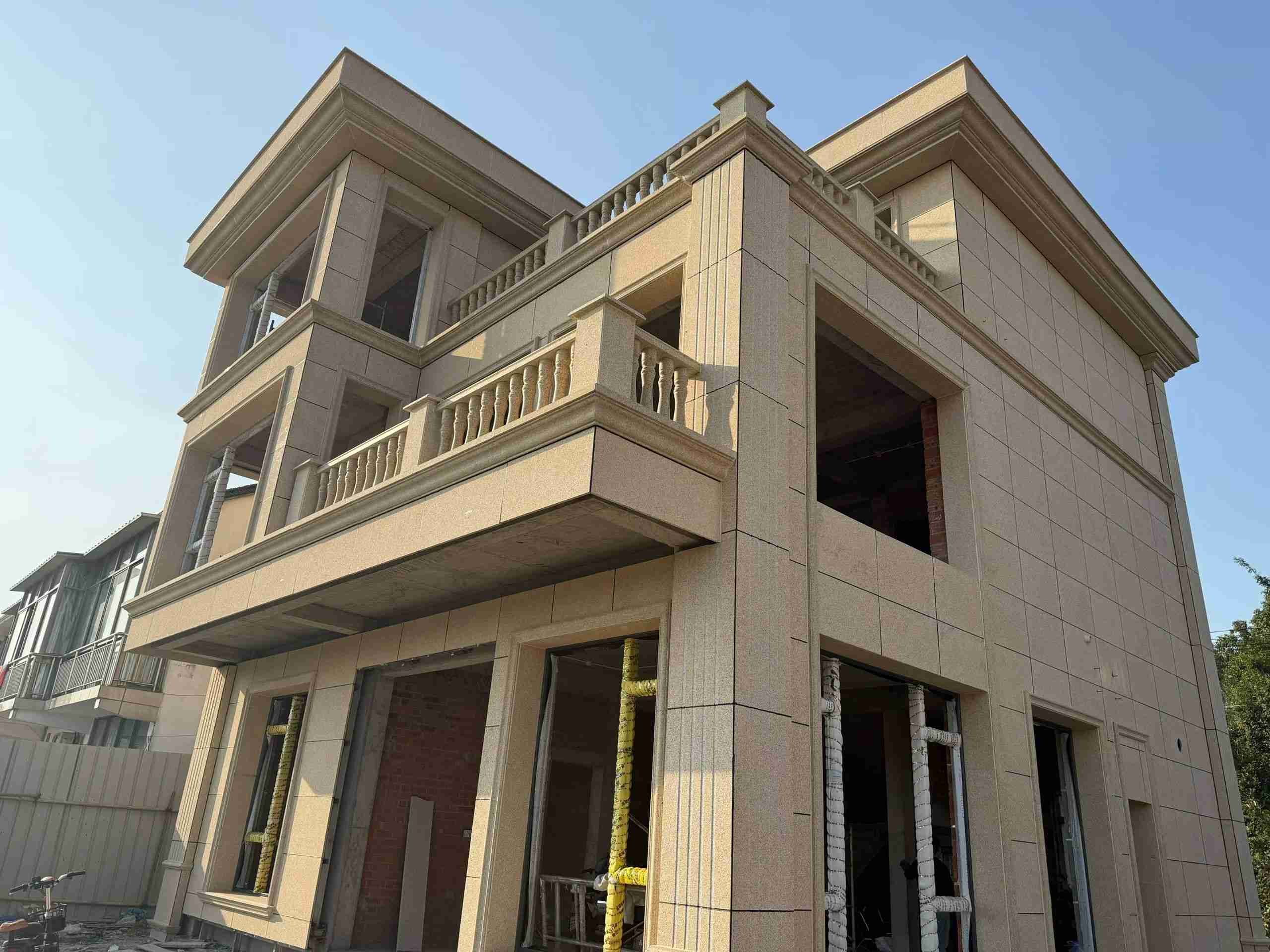 湖南 黄金麻花岗岩石材荔枝面外墙干挂效果展示